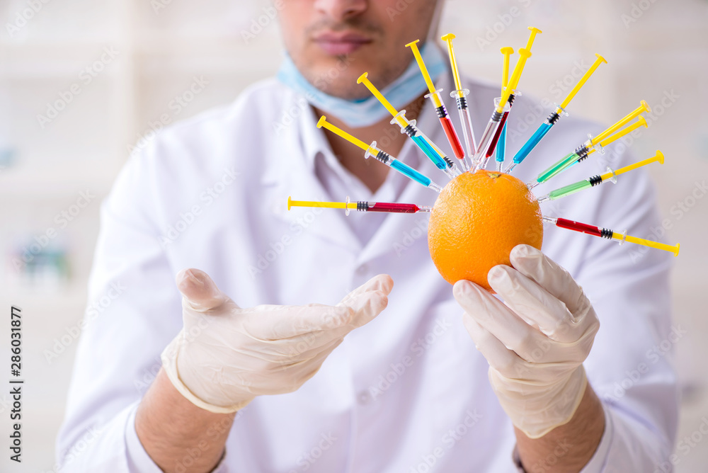 Male nutrition expert testing food products in lab Male nutrition expert testing food products in lab
