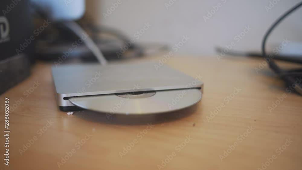DVD pops out of an external drive. DVD pops out of an external drive.