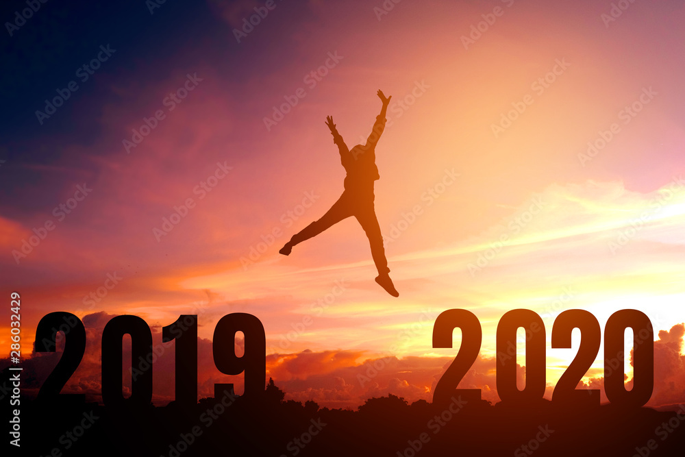 2020 New year Silhouette young man Freedom and Happy new year concept 2020 New year Silhouette young man Freedom and Happy new year concept