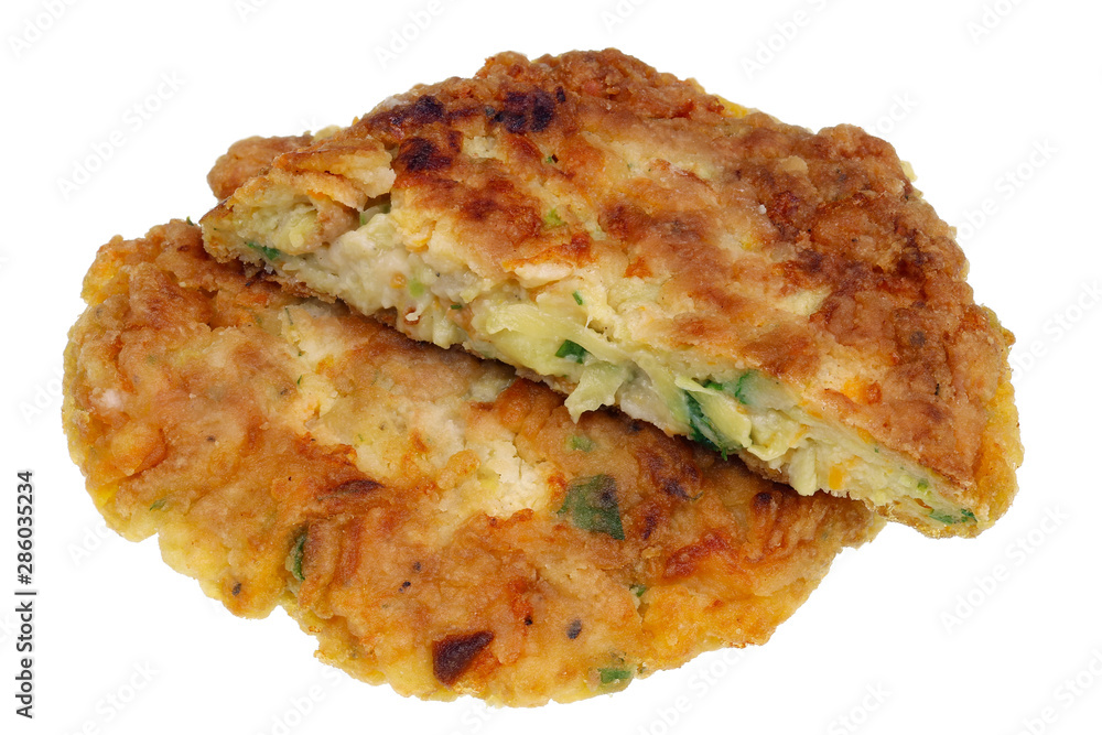 Fried vegetable pancakes from zucchini marrow carrots onions and herbs isolated macro Fried vegetable pancakes from zucchini marrow carrots onions and herbs isolated macro