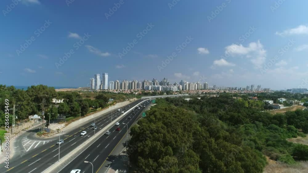Aerial shot of road leading to modern residential area Aerial shot of road leading to modern residential area