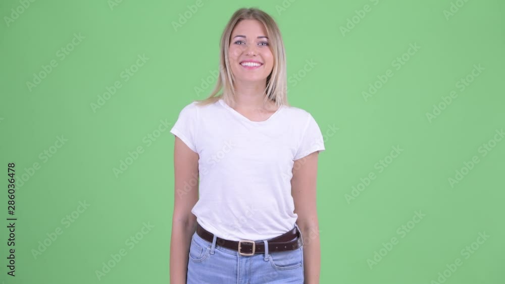 Happy young beautiful blonde woman smiling Happy young beautiful blonde woman smiling