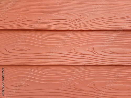 wood texture background...The abstract surface of the wall is a beautiful orange-colored wood panel.