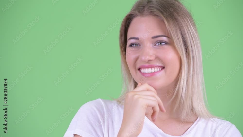 Face of happy young beautiful blonde woman thinking and looking up Face of happy young beautiful blonde woman thinking and looking up