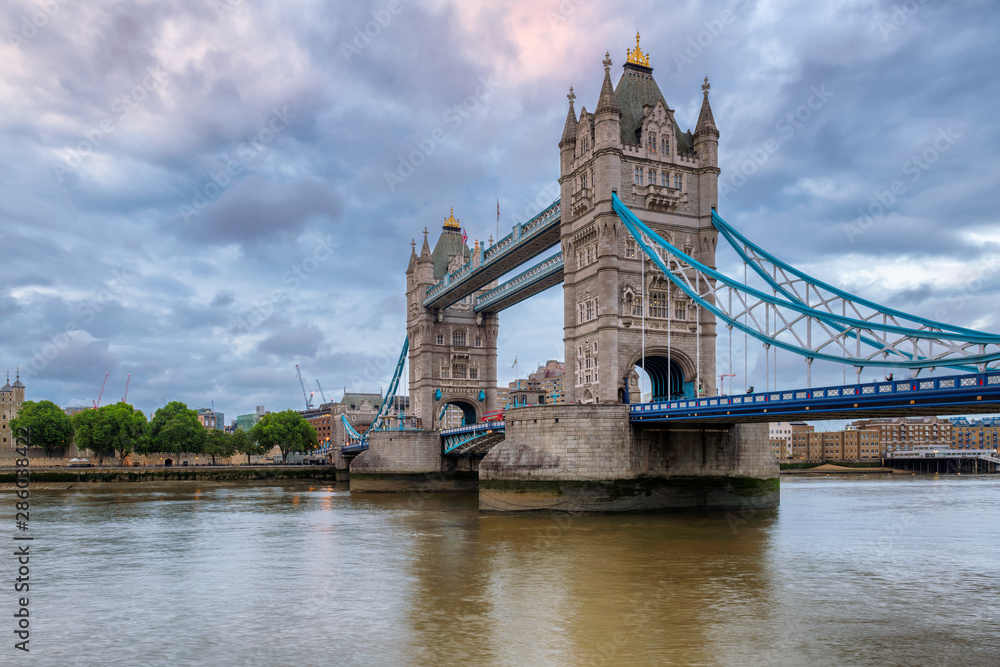 Spectacular Tower Bridge in London, UK at evening time with beautiful clouds.