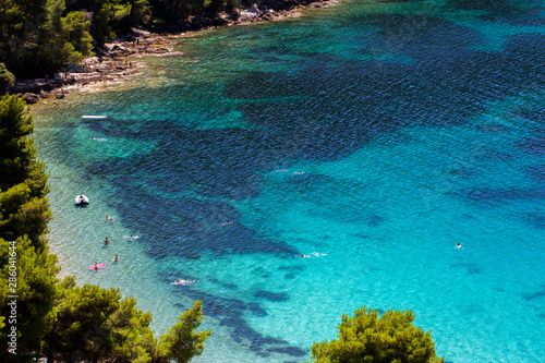People enjoying summer on Vucine beach - Peljesac peninsula, Croatia
