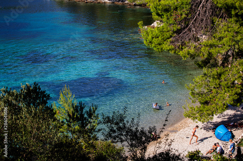 People enjoying summer on beach near Zuljana, Croatia photo