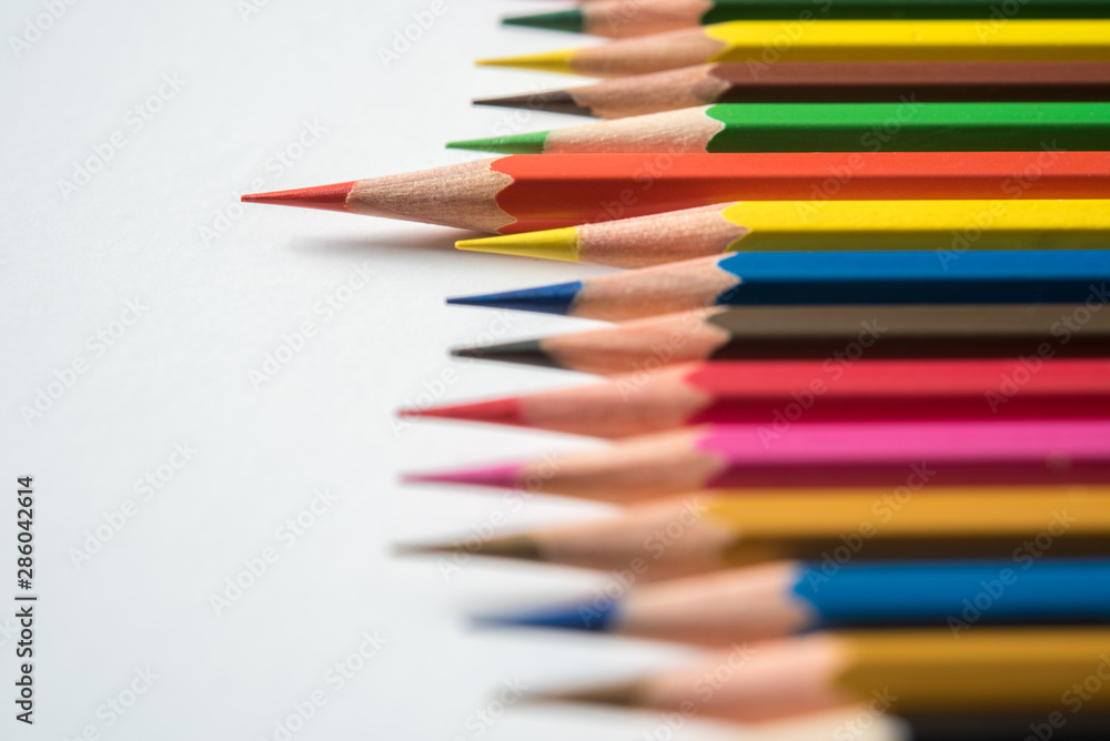 rows of multicolor pencil on white background rows of multicolor pencil on white background