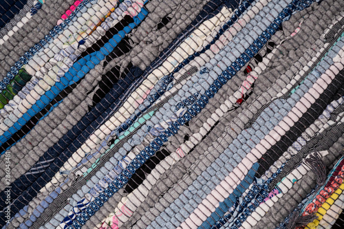 Texture of a multi-colored rug made from different fabrics