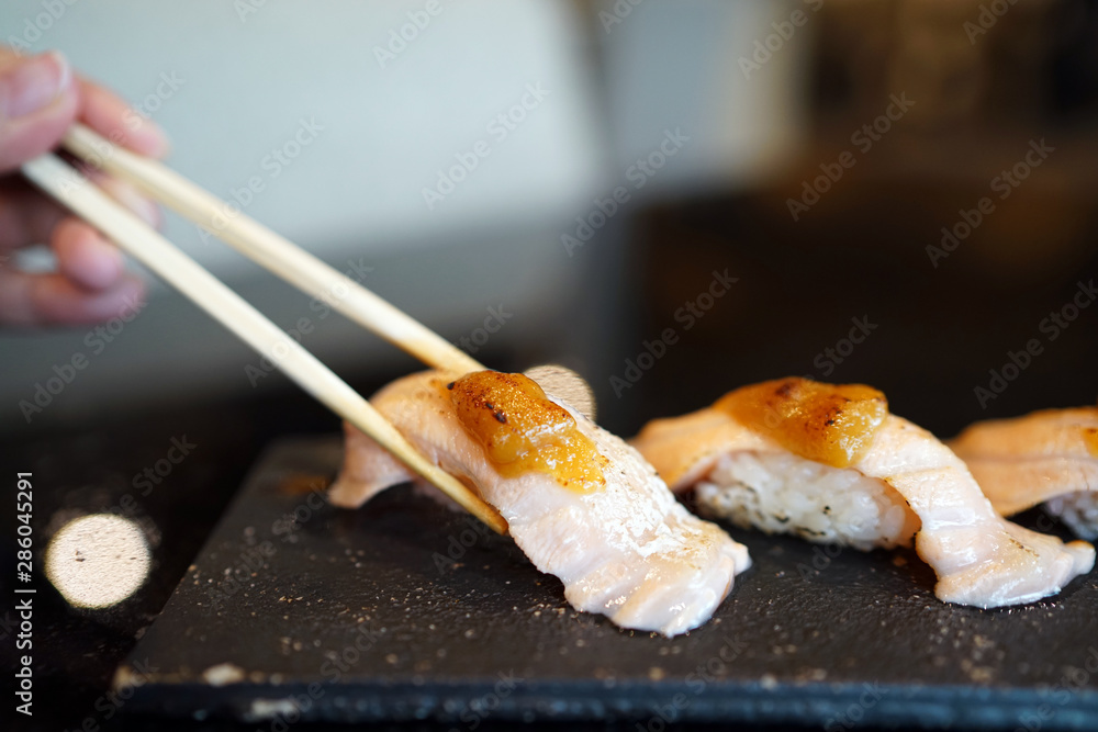 Grilled salmon sushi - Set of salmon aburi sushi topped with sweet
