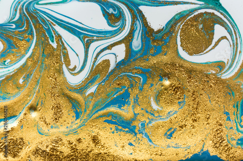 Amazing luxury yellow gold marble background with blue and white layers.