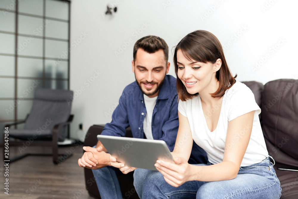 Couple using tablet for browsing internet Couple using tablet for browsing internet