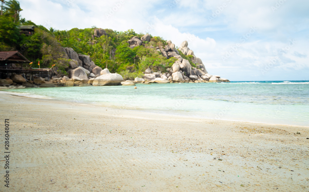 Looking at the rocks on the beach.