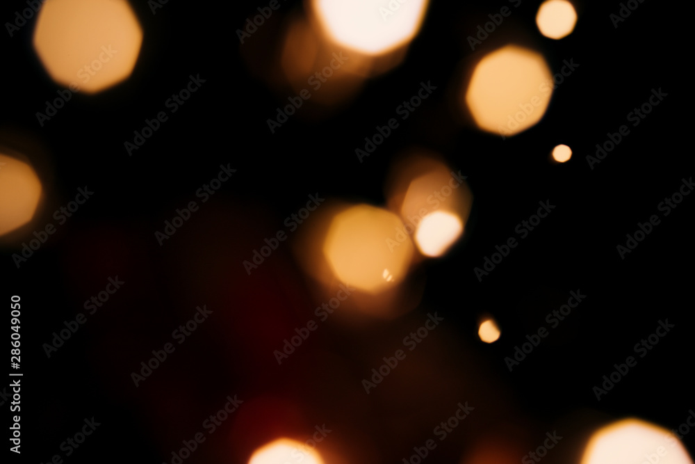 Golden abstract bokeh sparkle on black isolated background. Holiday concept. Place for design. Festive concept. Golden abstract bokeh sparkle on black isolated background. Holiday concept. Place for design. Festive concept.