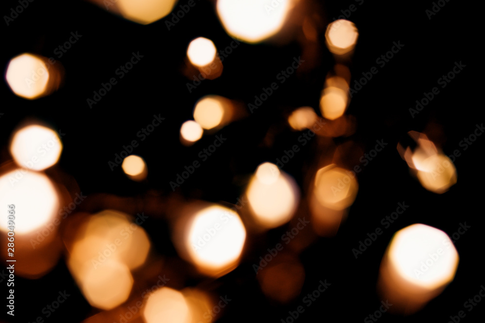 Golden abstract bokeh sparkle on black isolated background. Holiday concept. Place for design. Festive concept. Golden abstract bokeh sparkle on black isolated background. Holiday concept. Place for design. Festive concept.