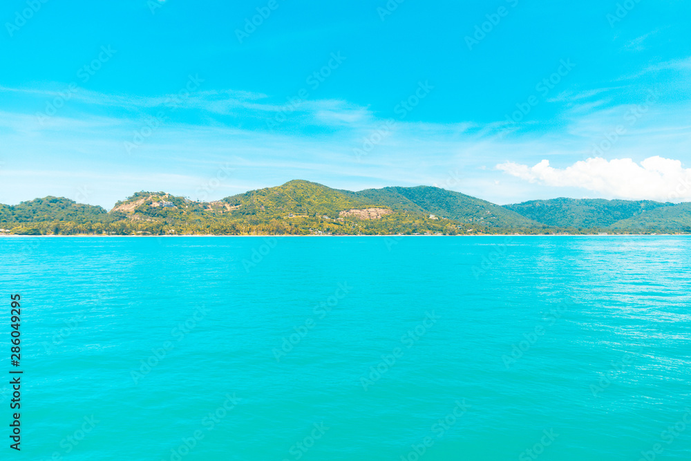 Looking at the Island, blue water and sky. Looking at the Island, blue water and sky.