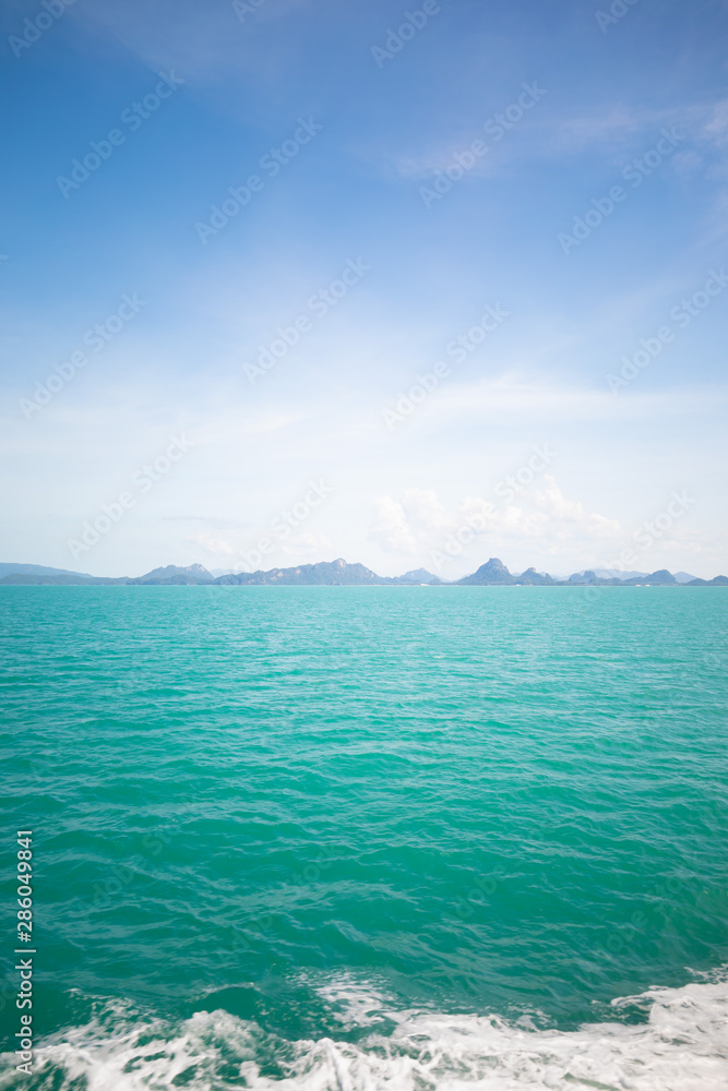 Looking at the Island, blue water and sky.