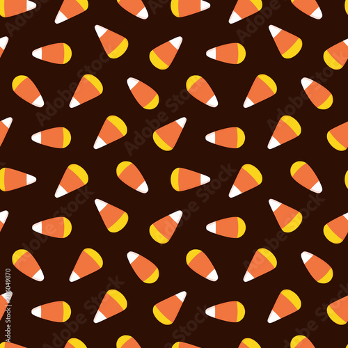 Vector cartoon style seamless pattern background with candy corn, popular halloween sweets.