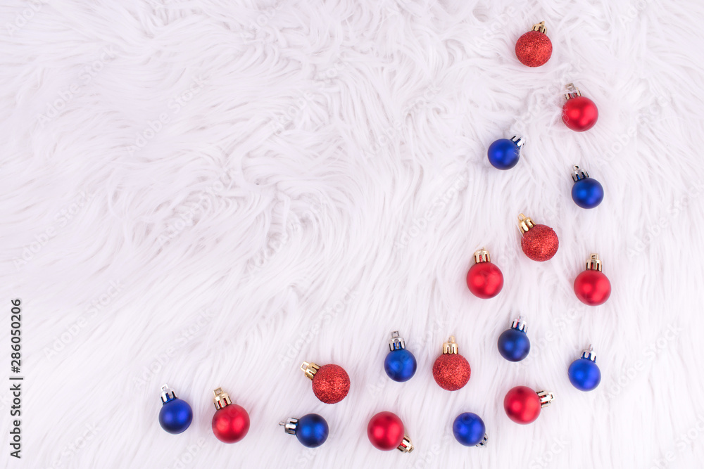 Christmas red and blue balls on white background. New year. Christmas composition. Flat lay, top view, copy space.