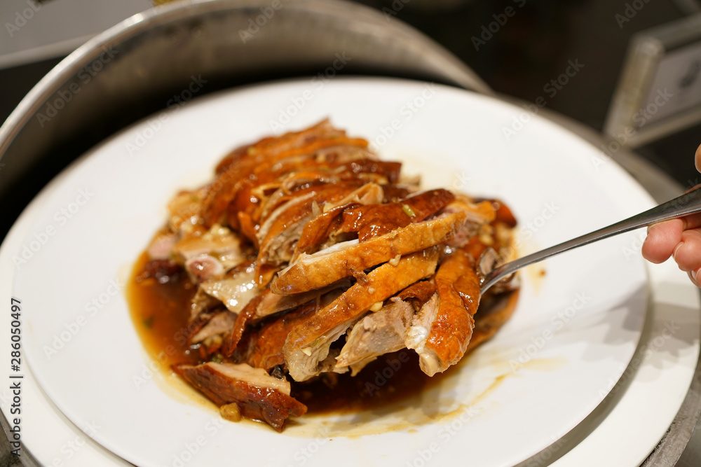 Grilled Peking duck - A plate of homemade roasted duck, Chinese food style. Grilled Peking duck - A plate of homemade roasted duck, Chinese food style.