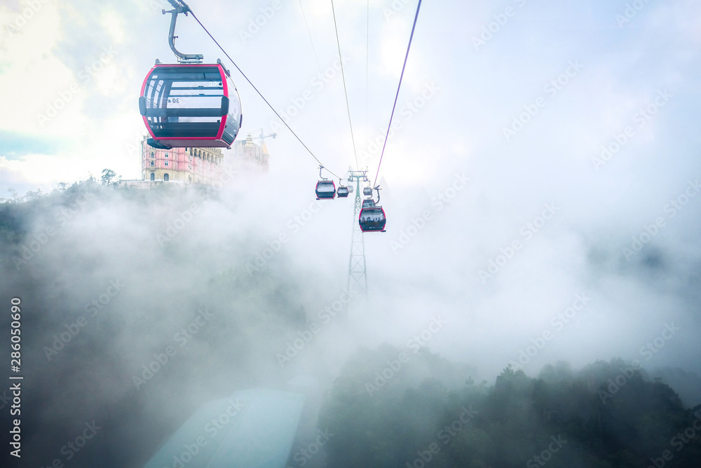 Cable car to Ba Na Hills Mountain Resort among fog. The longest nonstop single track cable car