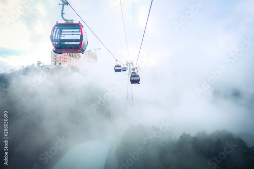 Cable car to Ba Na Hills Mountain Resort among fog. The longest non-stop single track cable car is 5,801meter, Da Nang, Vietnam.