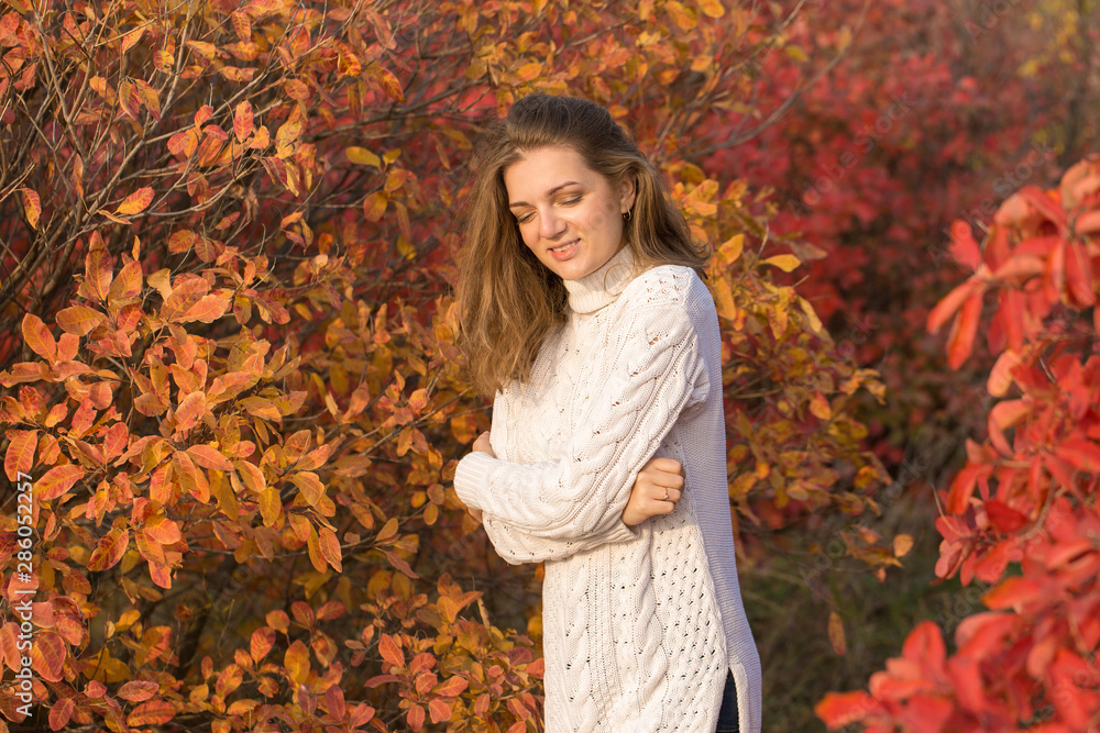 Autumn portrait of a girl in ethnic sweater Autumn portrait of a girl in ethnic sweater