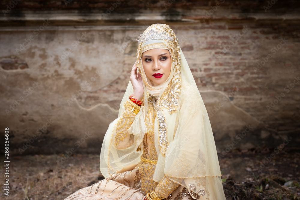Portrait Of Young Bride Wearing wedding Hijab Standing and Looking Away