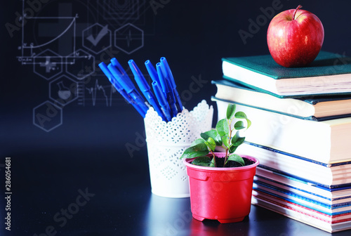 A stack of textbooks and books on the table. The concept of knowledge. photo