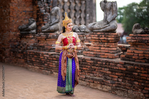 Portrait of Asian women with Thailand Traditional dresses against temple