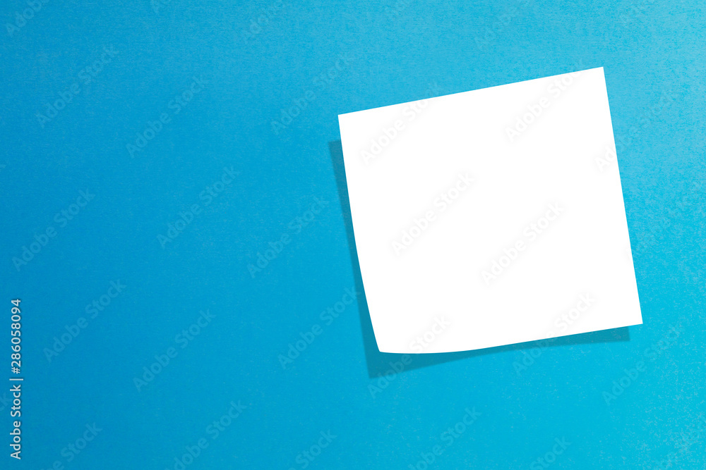 Empty note paper on blue background Empty note paper on blue background