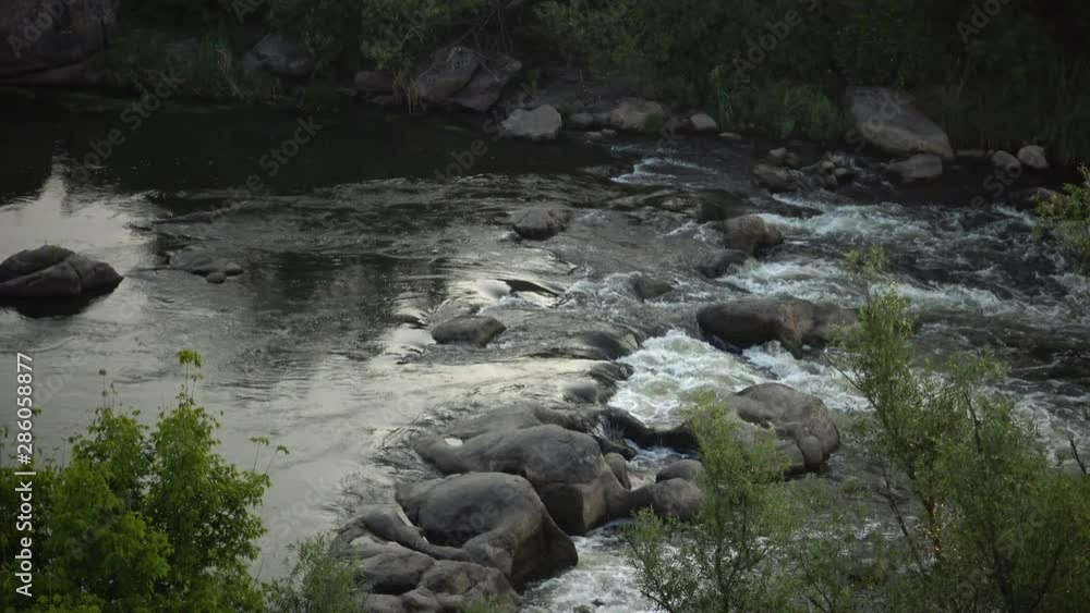 Granite rapids and rapids with rapidly flowing water on the South Bug River, Ukraine Granite rapids and rapids with rapidly flowing water on the South Bug River, Ukraine