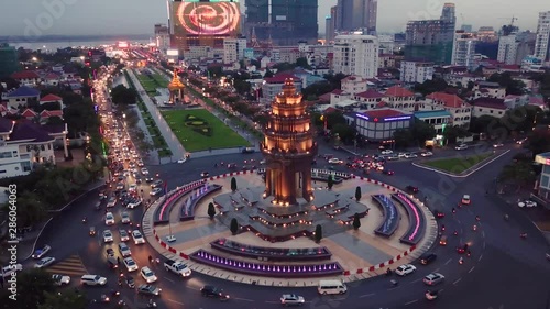 Aerial shot showing bright lights and traffic above the Independence Monument in Phnom Penh, Cambodia.