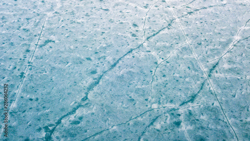 Blue Ice surface of Frozen Lake from drone aerial view at Pangong Lake or Pangong Tso, Tso moriri – Nubra, India. Abstract concept of Cold winter, peaceful and freedom.