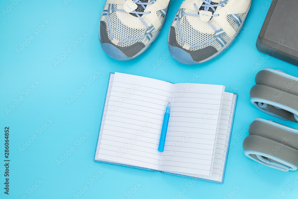 Flat lay of sport and fitness equipment on yellow background with copy space. Flat lay of sport and fitness equipment on yellow background with copy space.