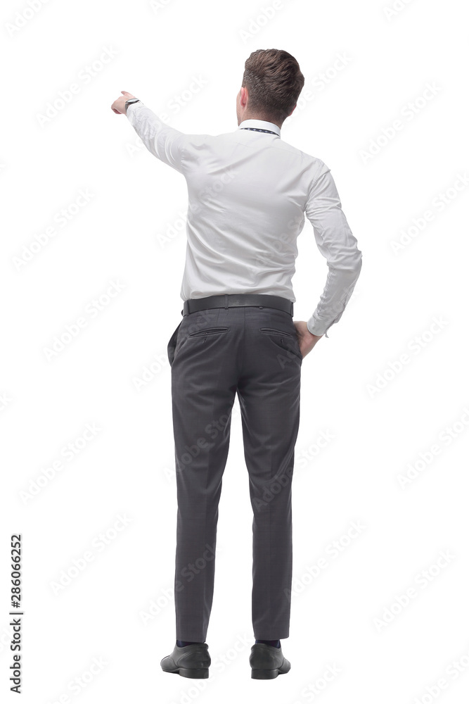 rear view.smiling young businessman pointing at white screen rear view.smiling young businessman pointing at white screen