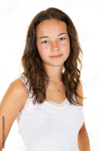 Young european woman standing wearing blank empty tshirt with copy space for your logo text isolated on white background © OceanProd