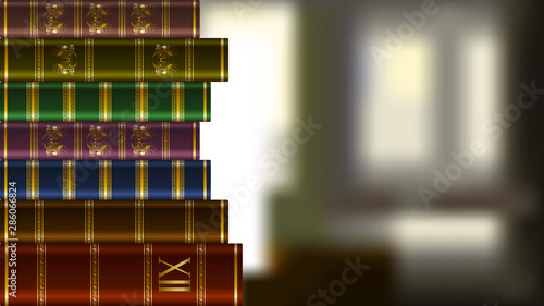 Stack of old expensive books on blurred background