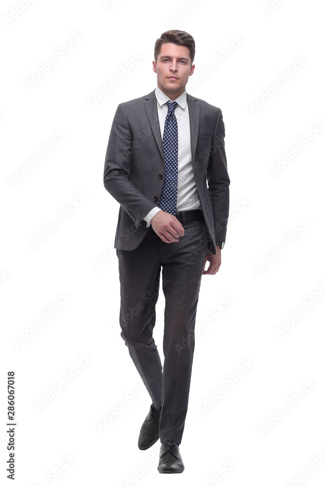 Executive young businessman confidently goes forward. isolated on white Executive young businessman confidently goes forward. isolated on white