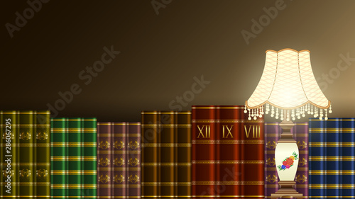 table lamp, stack books and painting in frame