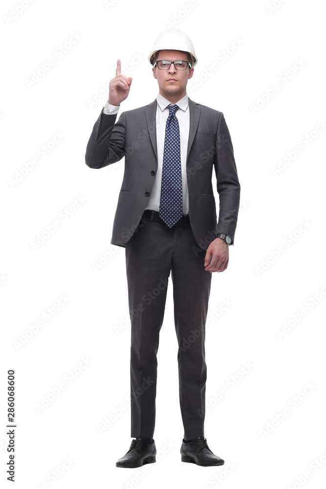 serious businesswoman in helmet pointing up . isolated on white serious businesswoman in helmet pointing up . isolated on white