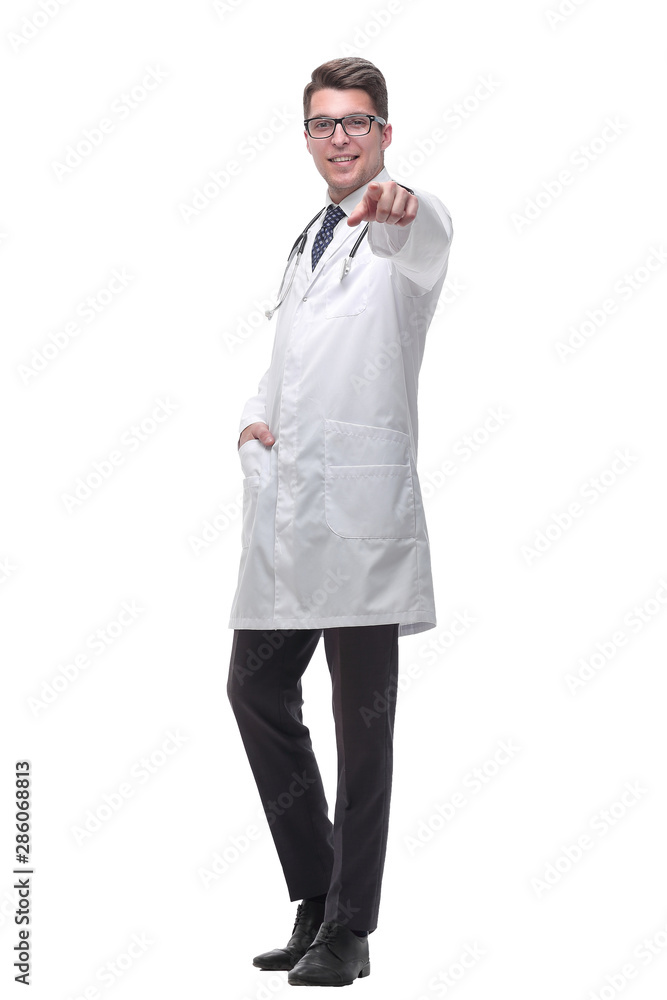 confident doctor with stethoscope pointing at you. isolated on white