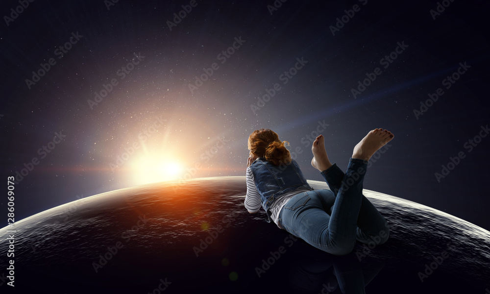 Young woman in casual clothes lying relaxed with feet raised up Young woman in casual clothes lying relaxed with feet raised up