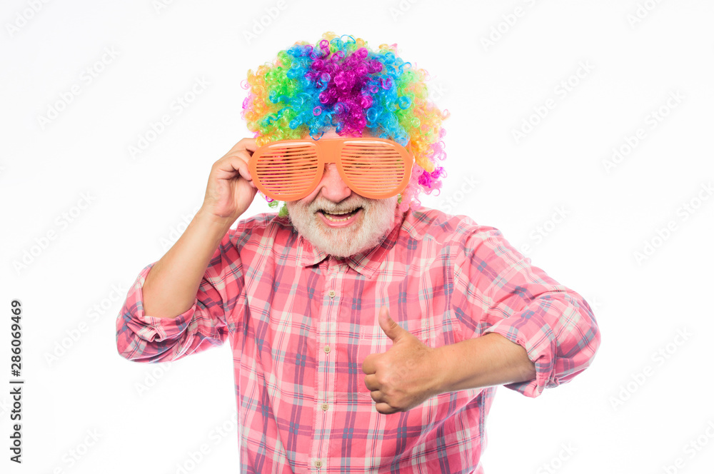 Funny idea. Crazy man in playful mood. mature bearded man in colorful wig and party glasses. anniversary holiday. happy birthday. corporate party. happy man with beard. Celebration retirement Funny idea. Crazy man in playful mood. mature bearded man in colorful wig and party glasses. anniversary holiday. happy birthday. corporate party. happy man with beard. Celebration retirement