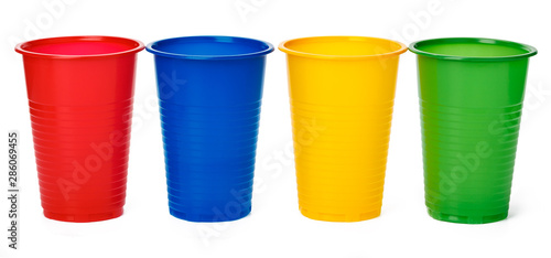 Colored plastic cups isolated on white background