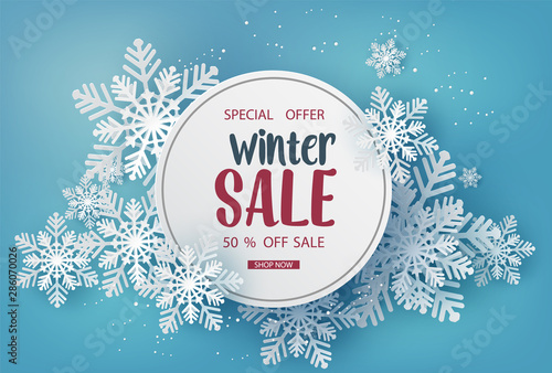 Winter Sale Banner with Snowflakes on Blue Background