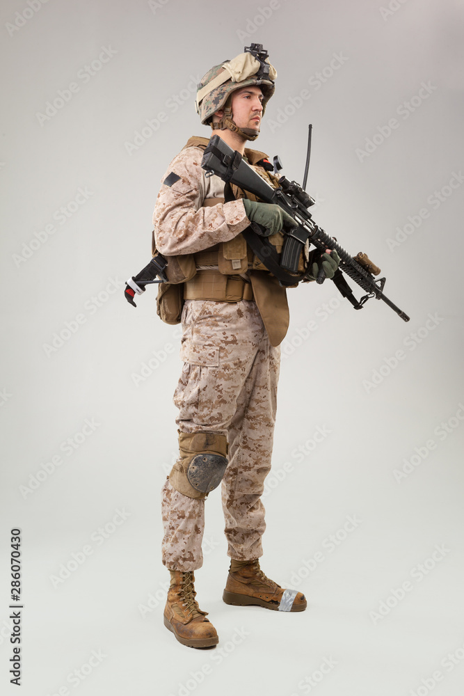 United states Marine Corps special operations command raider with weapon. Studio shot United states Marine Corps special operations command raider with weapon. Studio shot