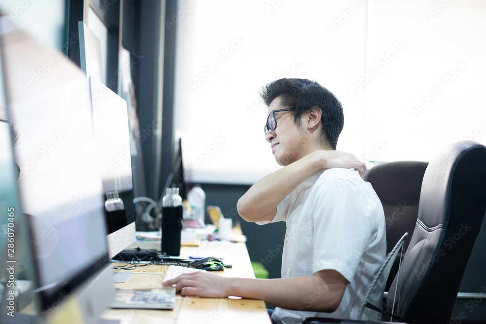 office worker is office syndrome, He has a headache and backache Because sitting for a long time office worker is office syndrome, He has a headache and backache Because sitting for a long time