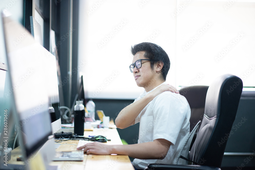 office worker is office syndrome, He has a headache and backache Because sitting for a long time office worker is office syndrome, He has a headache and backache Because sitting for a long time