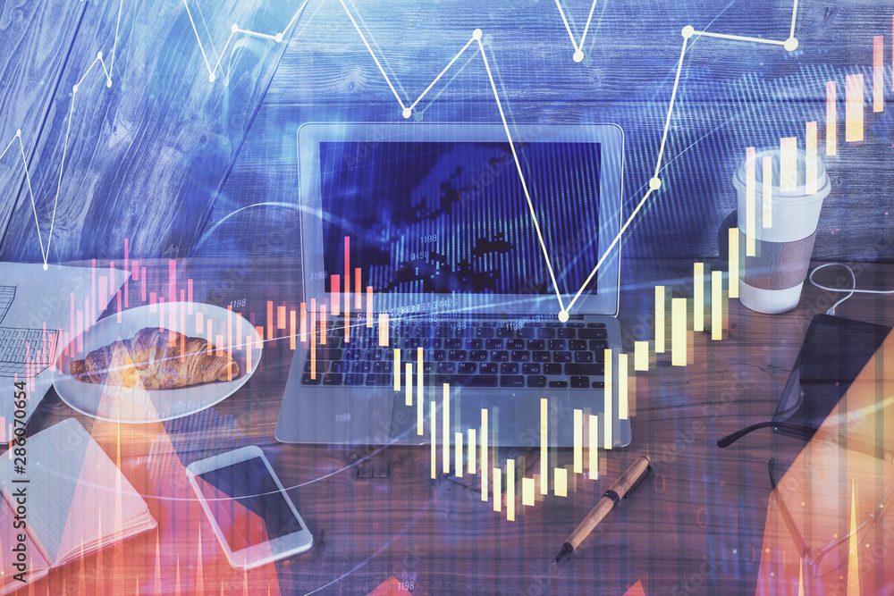 Multi exposure of forex graph and work space with computer. Concept of international online trading. Multi exposure of forex graph and work space with computer. Concept of international online trading.
